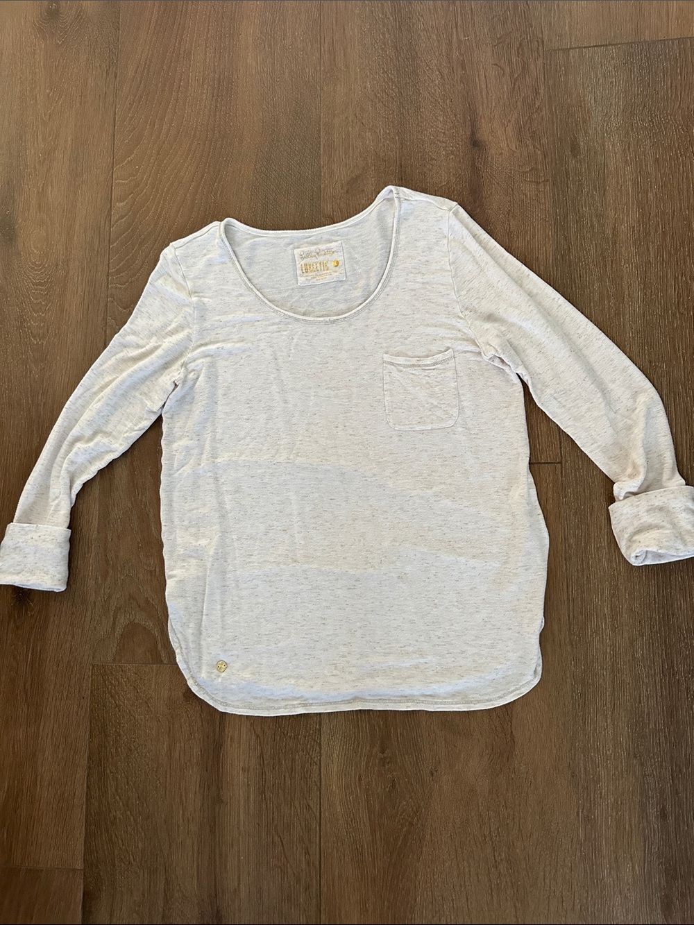 Lilly Pulitzer Cream Scoop Neck top with Gold Logo. Long sleeves.